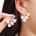 Elegant New Chinese White Enamel Plum Blossom Branch Alloy Flower Stud Drop Light Luxury Earrings view 1