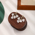 Elegant New Chinese White Enamel Plum Blossom Branch Alloy Flower Stud Drop Light Luxury Earrings view 2