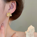 French Light Luxury Alloy Cat Eye Stone Flower Stud Earrings For Women Geometric Designer Jewelry view 3