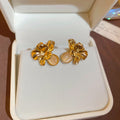 French Light Luxury Alloy Cat Eye Stone Flower Stud Earrings For Women Geometric Designer Jewelry view 4