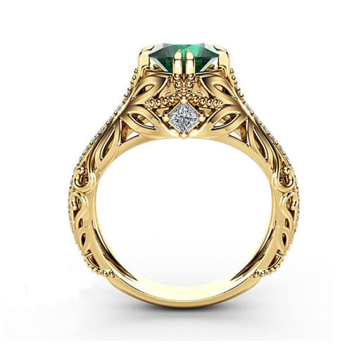 Interior view gold openwork ring green top stone clear accents