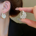 Chic Faux Pearl Hollow Flower Basket U Shaped Earrings, Light Luxury Floral Ear Cuffs view 1