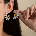 Elegant Luxury Daisy Flower Stud Earrings With Sparkling Rhinestone Petals And Yellow Crystal Center Earrings view 1