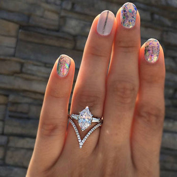 Silver Four Point Star Ring In A Polished Decorative Design