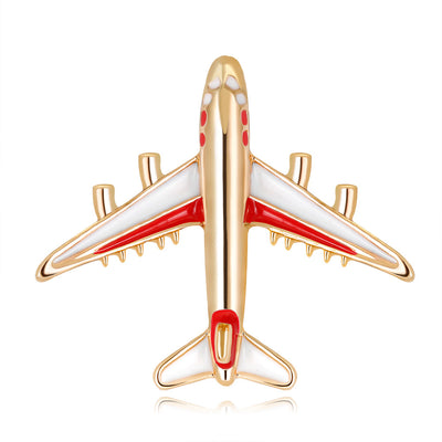 Front product view of the airplane brooch pin in gold and red