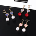 Gold Double Heart Sequin Pearl Look Dangle Earrings view 1
