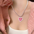 Light Luxury Vintage Court Style Faux Pearl Enamel Heart Pendant Necklace For Women view 1