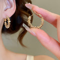 Irregular Crushed Silver Alloy Hoop Earrings Minimalist Light Luxury Round Design view 3