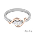Two Tone Swirl Round Stone Ring In A Polished Decorative Design view 5