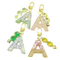 Metal Beige Letter Keychain With White Tassel Bag Charm view 5