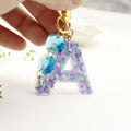Metal Beige Letter Keychain With White Tassel Bag Charm view 3