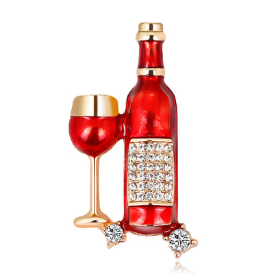 Front product view of the wine bottle and glass brooch pin in red and gold