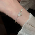Light Luxury Copper Bangle With Sparkling Zircon Heart Pendant For Women view 3
