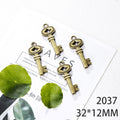 Antique Bronze Ornate Key Charms in Twenty Distinct Designs view 11