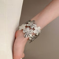 European American Exaggerated Metal Flower Bangle, Minimalist Luxury Designer Arm Cuff view 4