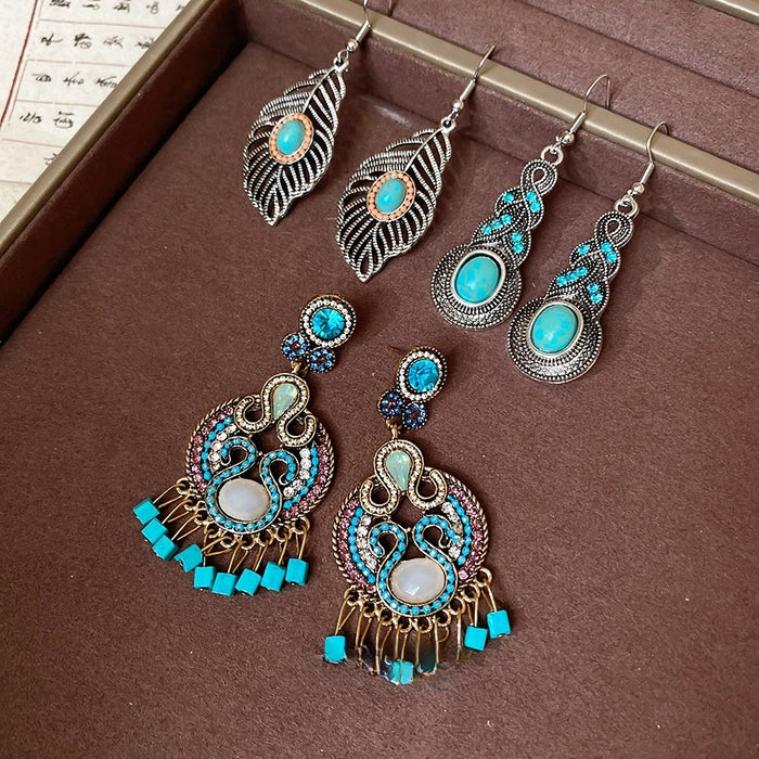 Vintage Ethnic Alloy Drop Earrings With Hollow Leaf Tassel And Oval Turquoise Geometric Pendant