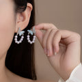 Elegant Rhinestone Butterfly Bow U Shape Simulated Pearl Tassel Stud Earrings for Women Luxury Earrings view 1