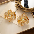 Luxury Gold Alloy Flower Pearl Stud Earrings For Women Statement Textured Metal Floral Party Earrings view 3