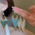 Light Luxury French Court Teardrop Faux Crystal Tassel Drop Earrings With Rhinestone Hollow Design view 2