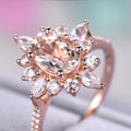Rose Gold Tone Oval Halo Ring With Peach Center Stone view 4