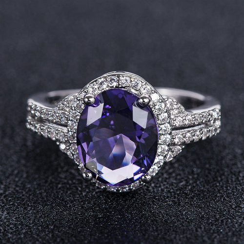 Silver Tone Oval Color Stone Halo Ring with Clear Stone Accents shown in styled view