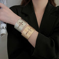 European American Metal Textured Hollow Cross Open Bangle For Women Fashion Niche Jewelry view 2