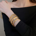 European American Glossy Textured Metal Bangle 8 Piece Fashion Versatile Round Bracelet For Women view 3