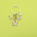 Zinc Alloy Rhinestone Butterfly Keychain With Pearl Bag Charm view 1