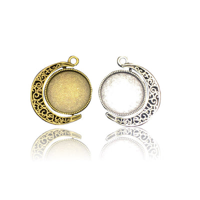 Gold-tone moon charms arranged on a light background