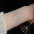 Light Luxury Copper Bangle With Sparkling Zircon Bow Pendant Clasp Elegant Bracelet view 1