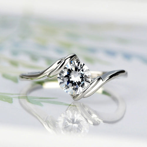 Silver-Tone Round Solitaire Ring With Twisted Open Band shown in angled product view