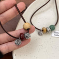 Light Luxury New Chinese Style Alloy Round Beaded Braided Rope Sweater Necklace For Women view 4