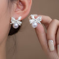 Elegant Silver Alloy Bowknot Pearl Stud Earrings For Women, Vintage Minimal Niche Design Versatile Earrings view 1