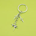 Zinc Alloy Hollow Four Point Star Keychain Car Bag Charm view 1