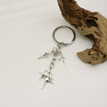 Zinc Alloy Hollow Four Point Star Keychain Car Bag Charm view 4