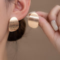 Vintage Gold Brushed Texture Irregular Oval Alloy Studs Elegant Light Luxury Metal Statement Earrings view 1