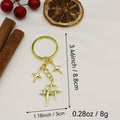 Zinc Alloy Hollow Four Point Star Keychain Bag Charm view 2