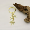 Zinc Alloy Hollow Four Point Star Keychain Bag Charm view 4