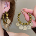 Vintage Ethnic Alloy Drop Earrings With Teardrop Wood Bead Geometric Round Tassel Pendant view 4