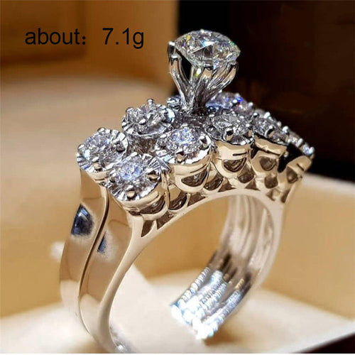 Silver-Tone High Set Round Solitaire Ring With Pave Shoulders shown in angled product view