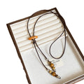 Vacation Style Wax Cord Round Ceramic Wood Bead Tassel Pendant Sweater Necklace For Women view 5