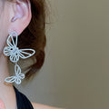 Light Luxury Copper Zircon Hollow Butterfly Asymmetric Drop Earrings With Silver Posts view 4