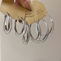 Minimalist Copper Geometric Cross Round Smooth Hoop Earrings For Women Light Luxury Style view 1