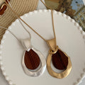 Light Luxury Wood Hollow Teardrop Pendant Sweater Necklace With Geometric Wrinkle Design view 1