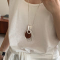 Light Luxury Wood Hollow Teardrop Pendant Sweater Necklace With Geometric Wrinkle Design view 2