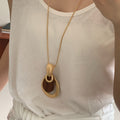 Light Luxury Wood Hollow Teardrop Pendant Sweater Necklace With Geometric Wrinkle Design view 4