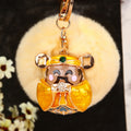 Jeweled Wealth Figure Keychains with Faux Fur Poms in Four Pictured Colors view 2