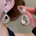 European Style Alloy Teardrop Textured Hollow Pendant Clip-on Earrings Fashion Statement Jewelry view 4