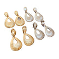 Light Luxury Zinc Alloy Teardrop Textured Hollow Pendant Clip-on Earrings view 5