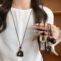 Vintage Ethnic Wood Resin Irregular Geometric Pendant Sweater Necklace With Round Oval Design view 4